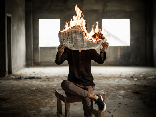Fire, newspaper, reading, man