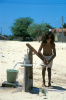 Child pumping water in the town of Barro Duro, Maranhão