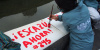 Child, sign, paint, demonstration, Peru, Escazu