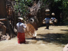 Women carrying pots in Myanmar