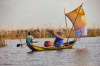 Boy and a woman fish in Ganvié, Bénin