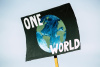 one world peace climate action protest sign planet